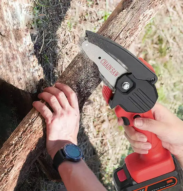 Using the Wood Ranger Mini Chainsaw to cut through a log